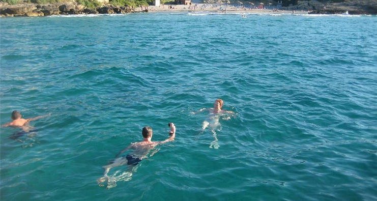 swimming stop in the boat trip in the bay of pollensa