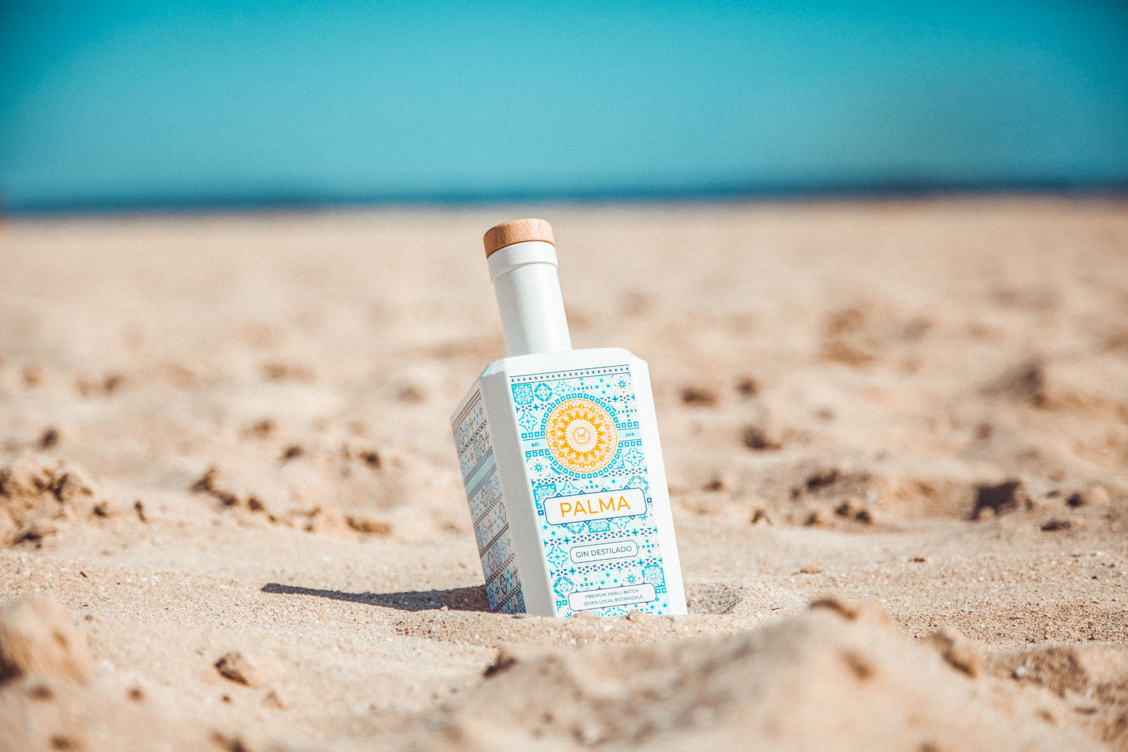 bottle of gin at the beach